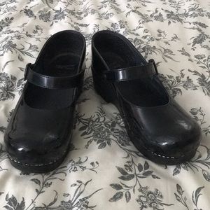 Dansko black patent leather clogs